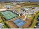 Aerial view of community amenities featuring tennis courts, a pool, bocce ball, and more at 4522 Shockoe Cir, The Villages, FL 32163