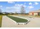 Image showing bocce ball courts in a community park with well-maintained landscaping and nearby residential buildings at 4522 Shockoe Cir, The Villages, FL 32163