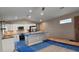 Bright kitchen with stainless steel appliances, white cabinets, and a kitchen island at 519 Sw 19Th Ave, Ocala, FL 34471