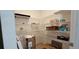 A walk-in pantry featuring white wire shelving and ample storage space at 519 Sw 19Th Ave, Ocala, FL 34471