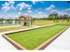 Well-maintained bocce ball court with a covered seating area at 6203 Sw 93Rd Loop, Ocala, FL 34476