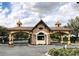 Elegant entrance to the community with stone and copper accents at 6203 Sw 93Rd Loop, Ocala, FL 34476