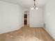 Dining room with neutral carpeting and a chandelier, adjacent to kitchen at 7947 Sw 80Th Place Rd, Ocala, FL 34476