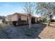 Exterior view of a single story house with a screened porch at 7947 Sw 80Th Place Rd, Ocala, FL 34476