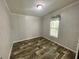 Bedroom featuring wood-look laminate flooring and neutral-colored walls at 11605 Nw 20Th St, Ocala, FL 34482