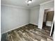 Bedroom featuring wood-look flooring and large closet at 11605 Nw 20Th St, Ocala, FL 34482