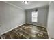 Bedroom featuring wood-look flooring and a window at 11605 Nw 20Th St, Ocala, FL 34482