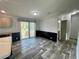 Dining area with sliding doors to the exterior, adjoining kitchen and boasting modern flooring at 11605 Nw 20Th St, Ocala, FL 34482