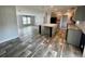 Bright and airy living room flowing into kitchen, boasting modern flooring and an open layout at 11605 Nw 20Th St, Ocala, FL 34482