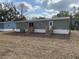 Rear view of manufactured home, showcasing two sets of stairs at 11625 Nw 20Th St, Ocala, FL 34482