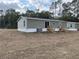 Rear view of the manufactured home, showing two sets of stairs at 11625 Nw 20Th St, Ocala, FL 34482