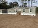 Front view of a manufactured home with landscaping at 11625 Nw 20Th St, Ocala, FL 34482