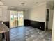 Dining area with wood-look floors and sliding glass doors to backyard at 11645 Nw 20Th St, Ocala, FL 34482