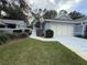 Gray two-story house with a two-car garage and well-manicured lawn at 8018 Sw 115Th Loop, Ocala, FL 34481