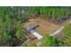 Aerial view of new construction home on a wooded lot at 8436 Sw 136Th Ter, Dunnellon, FL 34432