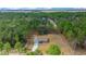 An aerial view showcasing a house nestled in a wooded area at 8436 Sw 136Th Ter, Dunnellon, FL 34432