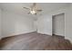 Bedroom with wood-look flooring and ceiling fan at 8436 Sw 136Th Ter, Dunnellon, FL 34432