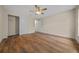 Bedroom with wood-look flooring and ceiling fan at 8436 Sw 136Th Ter, Dunnellon, FL 34432