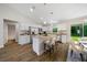 Modern kitchen with white cabinets,granite countertops, and island at 8436 Sw 136Th Ter, Dunnellon, FL 34432