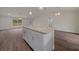 Kitchen island with granite countertop and white cabinets at 8436 Sw 136Th Ter, Dunnellon, FL 34432