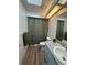 Cozy bathroom featuring a shower-tub combo with a shower curtain and a skylight at 8968 Sw 116Th Place Rd, Ocala, FL 34481