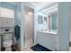 Bathroom featuring a shower, vanity with sink and medicine cabinet, and a toilet at 8968 Sw 116Th Place Rd, Ocala, FL 34481