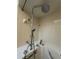 Close-up of a soaking tub with faucet controls and a handheld shower head at 8968 Sw 116Th Place Rd, Ocala, FL 34481