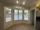 Bright breakfast nook with large windows and lots of natural light, tile floors, and pantry for storage at 8968 Sw 116Th Place Rd, Ocala, FL 34481