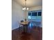 Cozy dining room with modern light fixture and an open view into the rest of the home at 8968 Sw 116Th Place Rd, Ocala, FL 34481