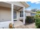 Inviting front porch with decorative lion statue at 8968 Sw 116Th Place Rd, Ocala, FL 34481