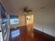 Gathering room with hardwood floors and view into kitchen area at 8968 Sw 116Th Place Rd, Ocala, FL 34481