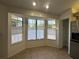 Bright kitchen nook with bay windows, stainless steel appliances, and pantry at 8968 Sw 116Th Place Rd, Ocala, FL 34481