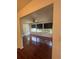 Bright living room featuring hardwood floors, large windows, and a ceiling fan at 8968 Sw 116Th Place Rd, Ocala, FL 34481