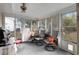 Relaxing screened porch with seating and backyard view at 8968 Sw 116Th Place Rd, Ocala, FL 34481