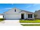 Charming single-Gathering home with a two-car garage, well-maintained lawn, and tidy landscaping at 9981 Se 161St Lane Rd, Summerfield, FL 34491