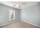 Simple bedroom with ceiling fan and neutral decor at 21 Fisher Trail Pass, Ocklawaha, FL 32179