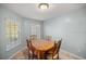 Bright dining room with wood table and chairs at 21 Fisher Trail Pass, Ocklawaha, FL 32179