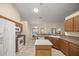 Spacious kitchen with ample counter space and wood cabinets at 21 Fisher Trail Pass, Ocklawaha, FL 32179