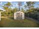 Tan plastic storage building in backyard at 21 Fisher Trail Pass, Ocklawaha, FL 32179