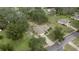 Aerial view of single story home with driveway and large lot at 213 W Lady Lake Blvd, Lady Lake, FL 32159