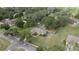 Aerial view showing house, large backyard, and surrounding neighborhood at 213 W Lady Lake Blvd, Lady Lake, FL 32159