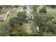 Aerial view showing house, large backyard, and surrounding neighborhood at 213 W Lady Lake Blvd, Lady Lake, FL 32159