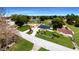 Aerial view of a single Gathering home with a large yard and surrounding houses at 7 Teak Loop Pl, Ocala, FL 34472