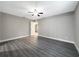 Bright bedroom with ceiling fan, neutral walls, and vinyl flooring at 7 Teak Loop Pl, Ocala, FL 34472