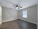 Well-lit bedroom, ceiling fan, wood-look floors at 7 Teak Loop Pl, Ocala, FL 34472