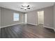 Spacious bedroom with neutral walls, vinyl flooring, and ceiling fan at 7 Teak Loop Pl, Ocala, FL 34472