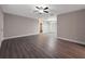 Open concept living room with gray vinyl plank flooring and neutral walls at 7 Teak Loop Pl, Ocala, FL 34472