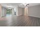 Bright living room featuring gray vinyl plank flooring and updated lighting at 7 Teak Loop Pl, Ocala, FL 34472