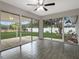 Sunroom with tile floors and sliding glass doors leading to the backyard at 7 Teak Loop Pl, Ocala, FL 34472