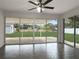 Sunroom with tile floors, ceiling fan, and backyard access at 7 Teak Loop Pl, Ocala, FL 34472